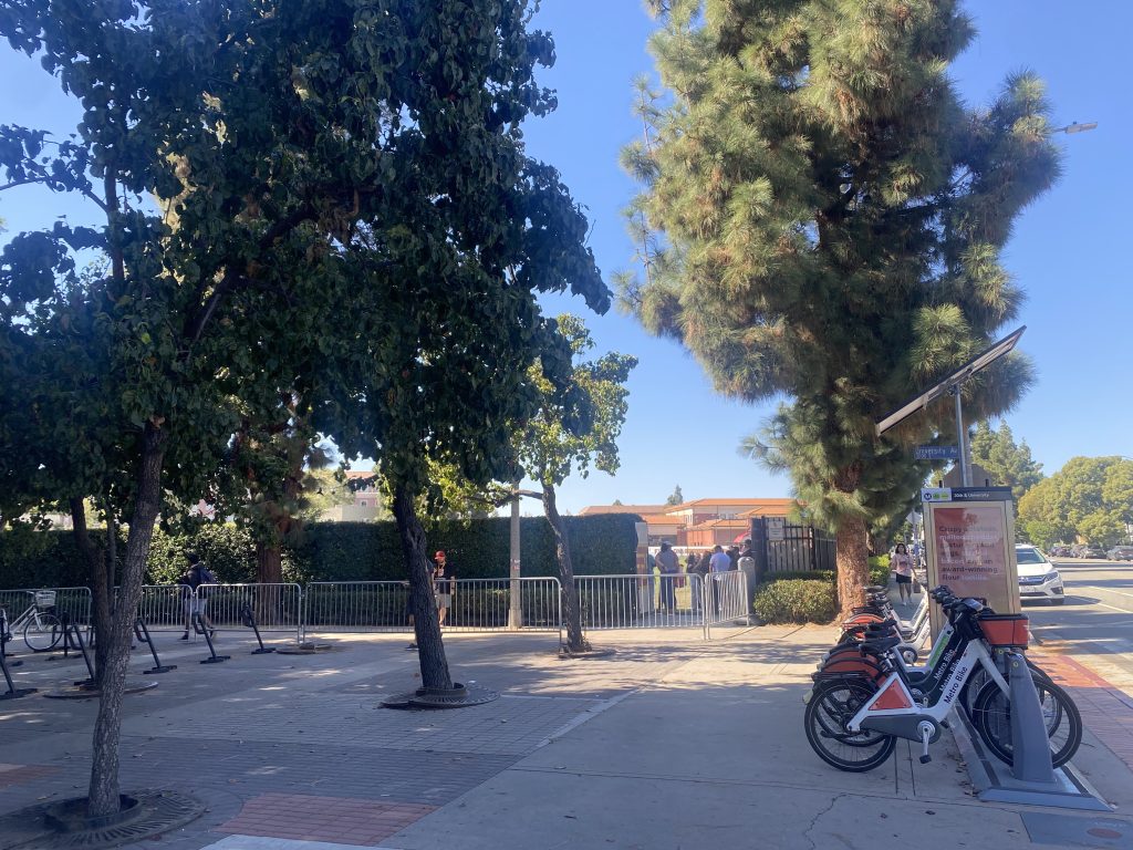 View of the entrance at Soni McAlister Field, with fences lining the walkway for fans to enter through the fences.