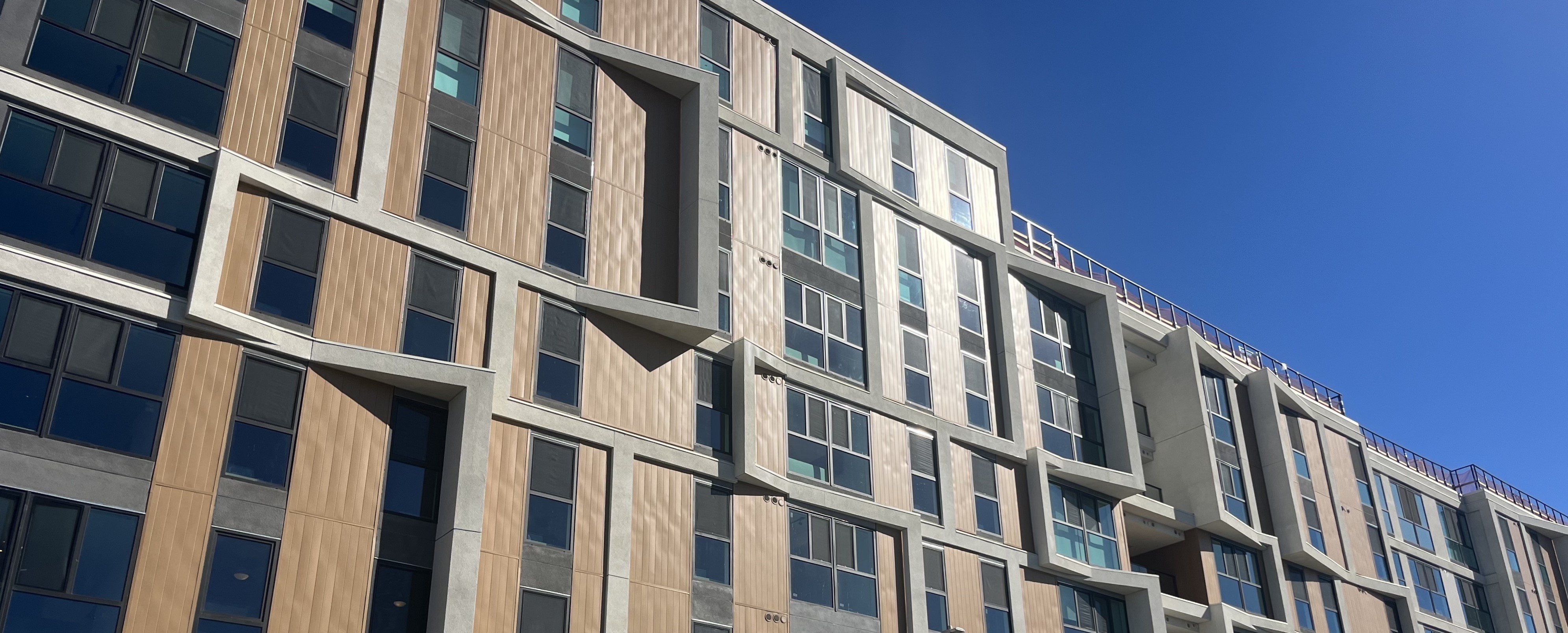 A photo of the exterior of The Hub Figueroa apartment building.