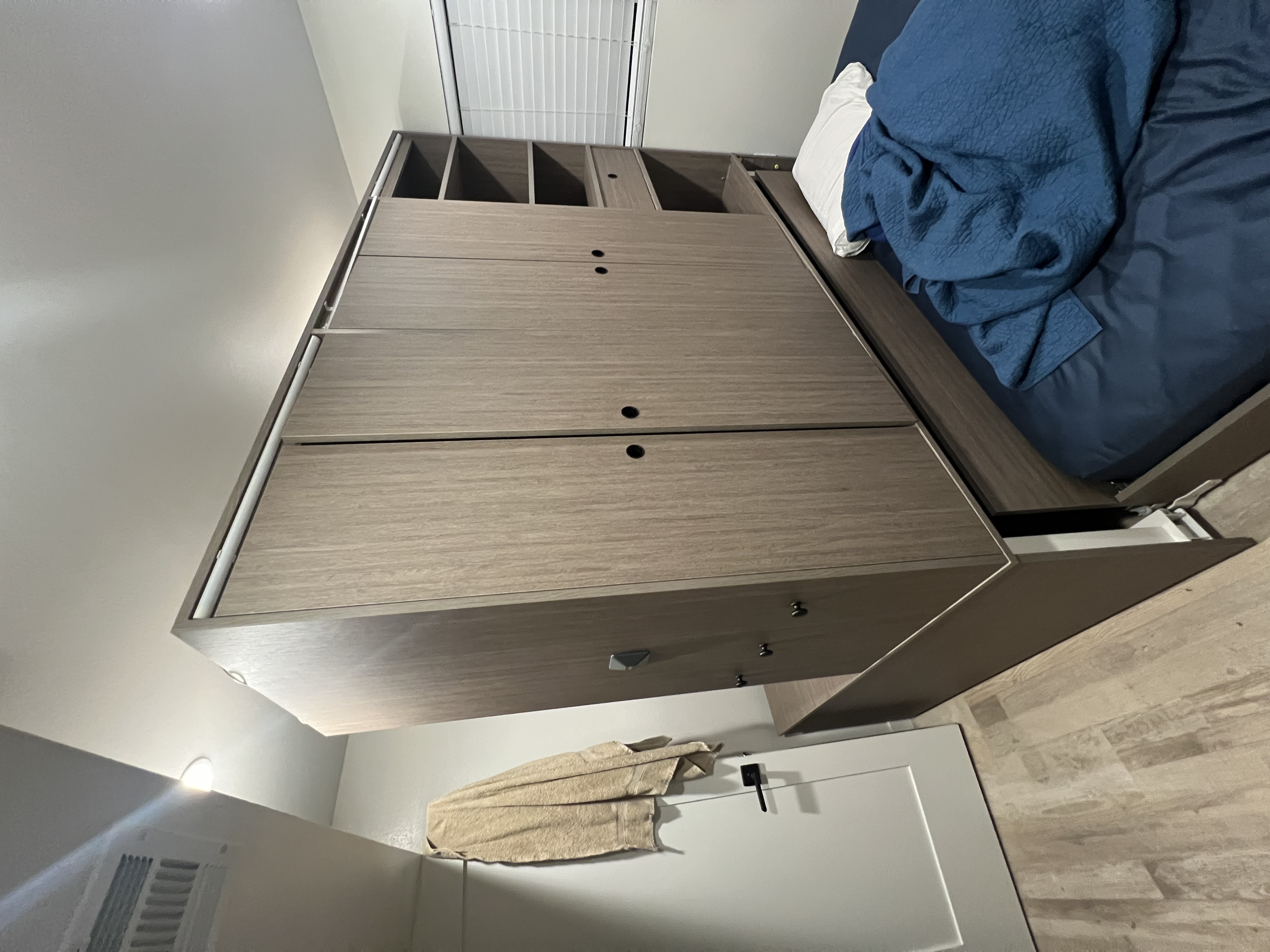 A photo of the 3-in-1 bed, desk and closet system in Cohen's apartment
