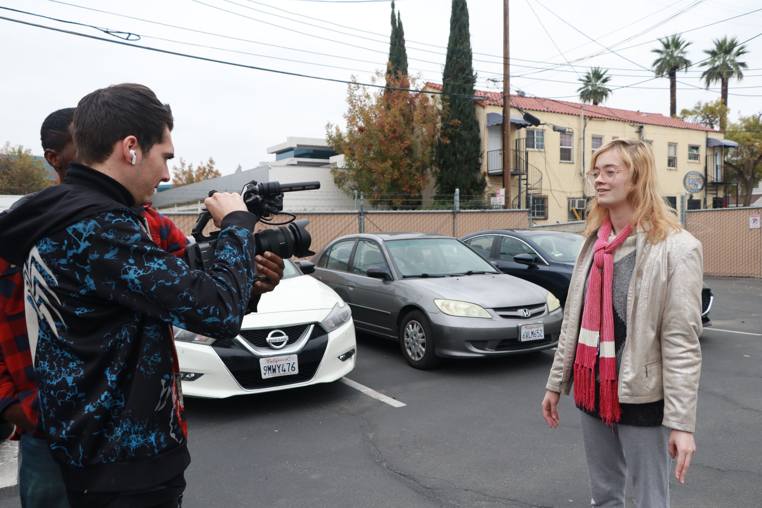 Students in the camera operation class (left) and acting class (right pair up for an exercise.