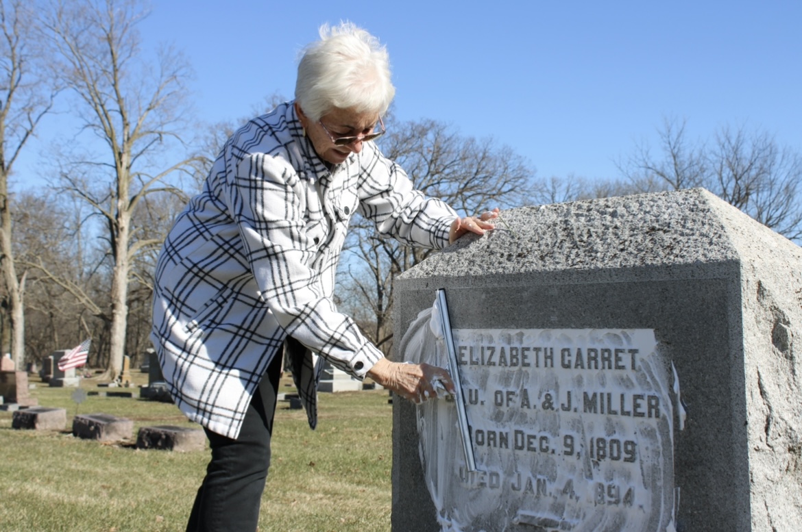 Martin scrapping off the excess shaving cream with a window squeegee.